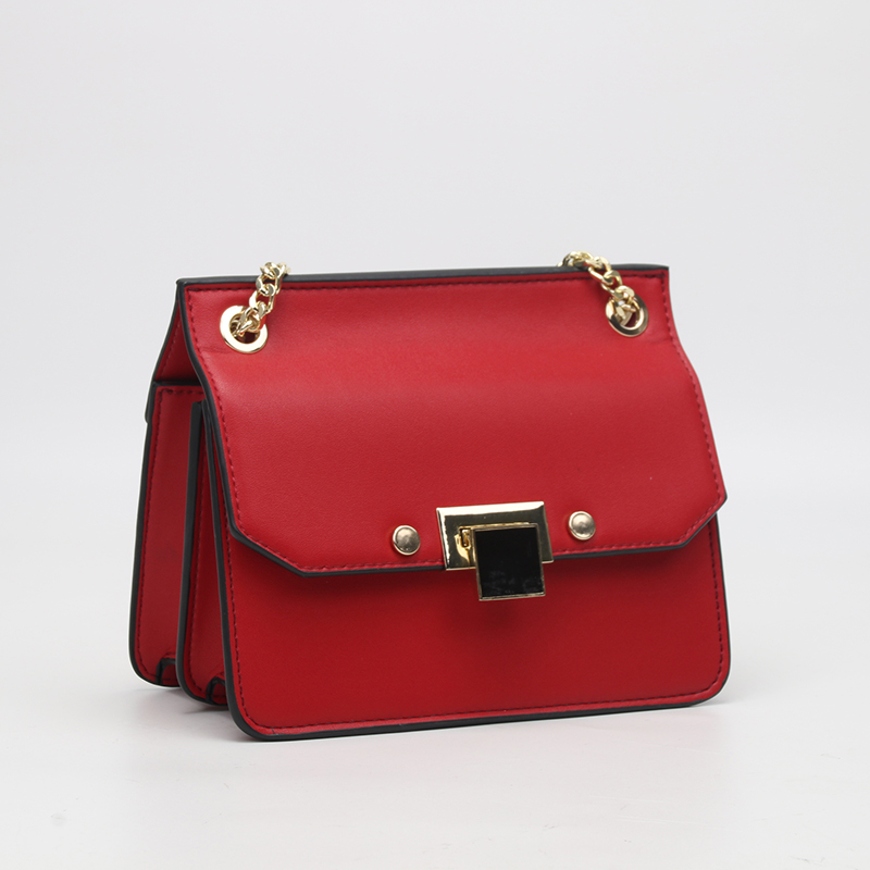 orange crossbody purse with lock closure