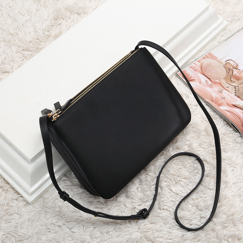 black triple compartment crossbody bag